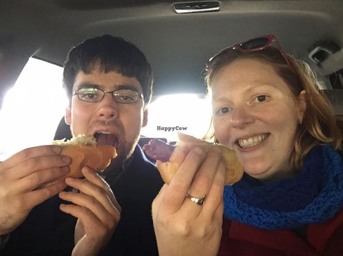 enjoying vegan dogs at Rescue Dogs - Food Cart in Hamilton