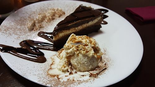 Triple chocolate cake with ice cream and whipped cream at Ayana in Petach Tikva