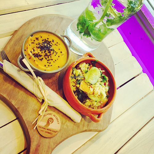 Daily menu- seasonal, local and organic. Vegan pumpkin soup with coconut oil and quinoa salad with homemade vegan macadamia ricotta cheese. at OWL Organic Market in San Pedro De Alcantara