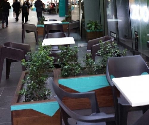 Outside seating in Madame Brussels Lane at Zoom Organic in Melbourne