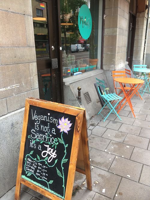Outdoor seating (in chilly October!) and a beautiful sign  at Mahalo - Hornsgatan in Stockholm