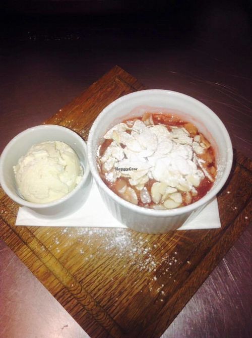 Apple and plum compote with toasted almonds and dairy-free ice cream. at The Vittoria in Bristol