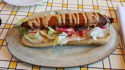 Carrot hot dog with spicy aioli on steamed bun at Miss Kaplan in Tel Aviv