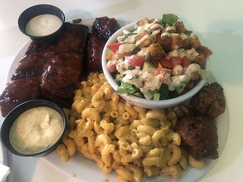 Share plate with Mac n cheeze, seitan ribs, salad and wings at Homegrown Smoker in Portland