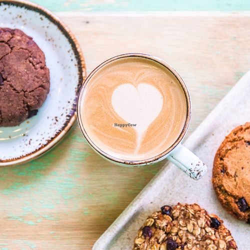 Almond coffee with vegan cookies at Kawa Kawa Bar in Omsk