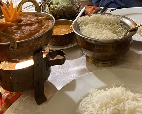 Yummy vegan cauliflower and potato stew served with rice (lamb and another sauce in the background). at Namaste Nepal in Chemnitz