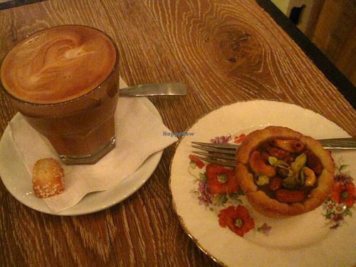 Caffe Latte with a caramel tarlet. Perfect. The coffee is great and the nutty tartlet is filled with a delicious caramel sauce. at Cafe Dei Campi in Montreal