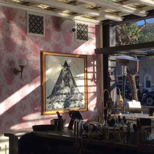 the goth-y artwork with the pink wallpaper - love it! at Kindred in San Diego