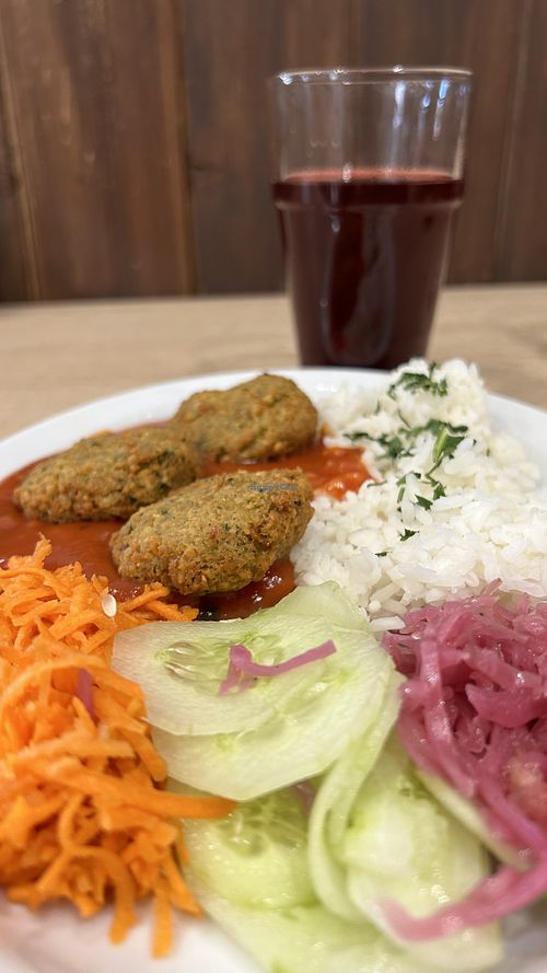 Falafel, rice, tomato sauce and salads, and fresh kompot  at Bar Górski in Zakopane