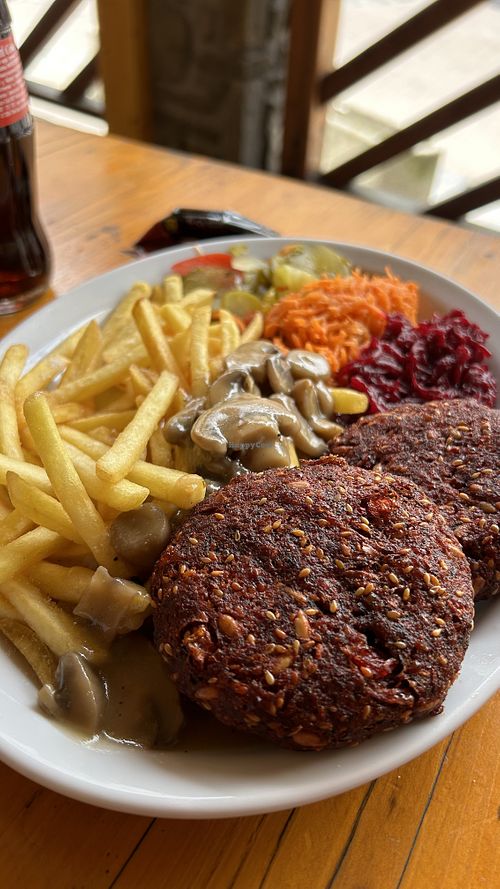 Beetroot patties, fries, mushroom sauce and salads  at Bar Górski in Zakopane