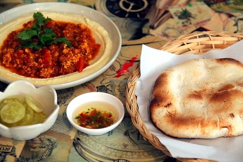 One of the many different hummus portions, pita and some spices.  at Gallery House of Hummus in Koh Phangan