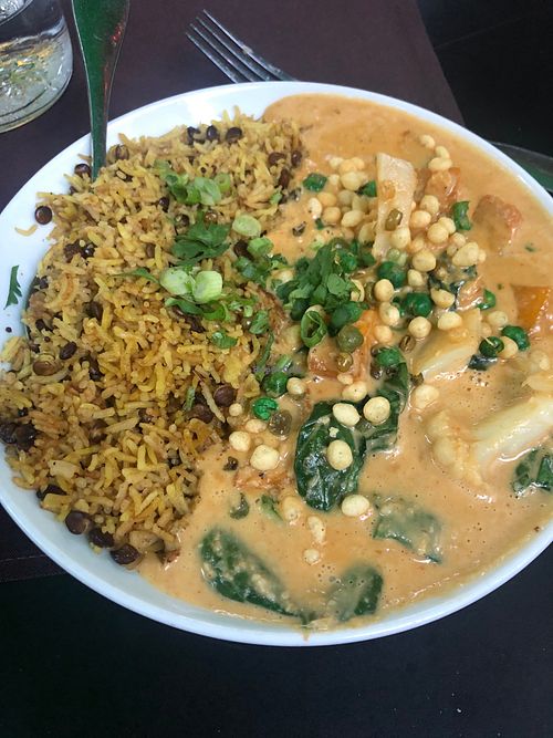 Cashew curry with rice and crispy lentils...super yummy!  at Veg Cafe in Sacramento