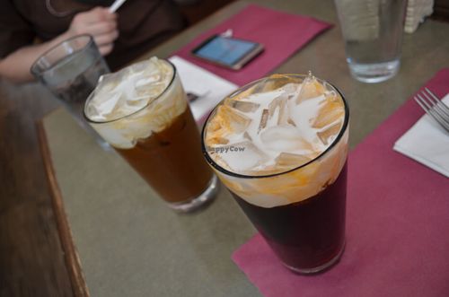 Thai tea (roiboos, red tea) and coffe. Both with ice and coconut milk (instad of the regular condensed milk. Included in the menu of the day at Thai Basil Restaurant in Sacramento
