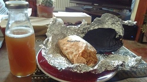 spicy bean burrito and tea  at Bia Kitchen Vegan Diner - Food Stall in Norwich