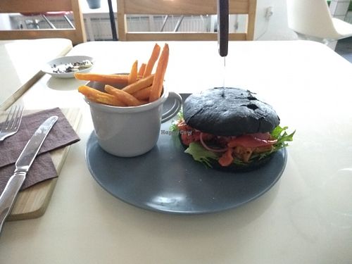 Vegan kebab burger (with pickled onion) and sweet potato fries at Kohvik Must Puudel in Tallinn