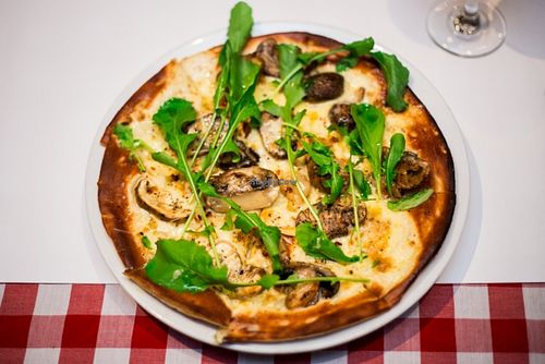 Bianco pizza - roast mushroom, mascarpone cheese,garlic and rocket on a thyme oil base at Farelli's Trattoria in Queenstown