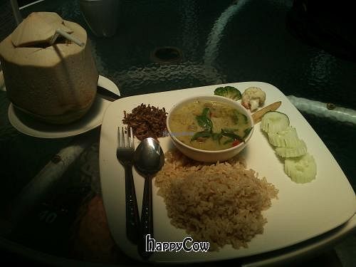 Curry whit rice and a coconut for 105 bath at Khun Churn in Chiang Mai