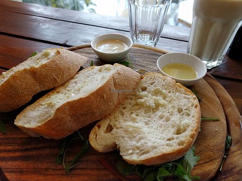 Garlic Bread, made vegan just for me. This is a half eaten portion. There is a vegan peanut butter milkshake in the background. at Etz Cafe in Jerusalem