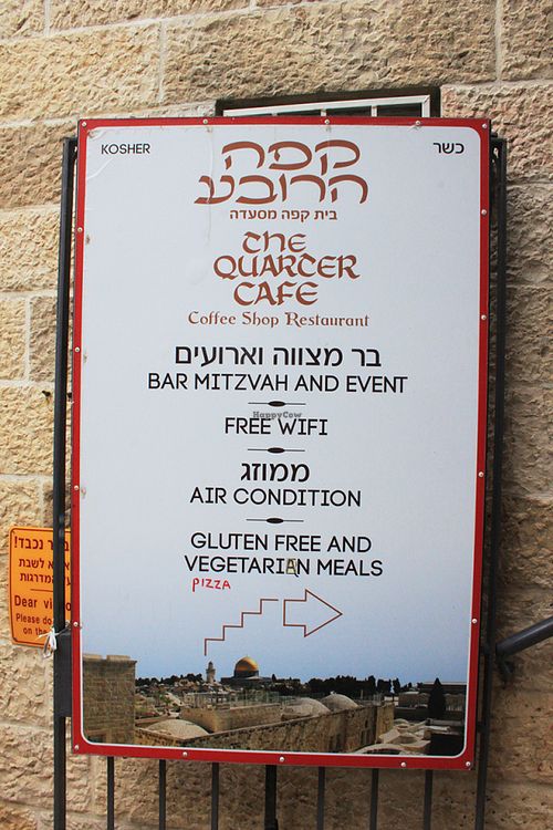Look for this sign, then go upstairs at The Quarter Cafe in Jerusalem