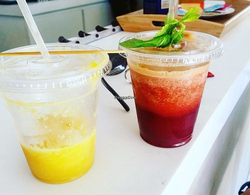 Juices named "sunshine" and "red" at Natural Cafe in Marigot