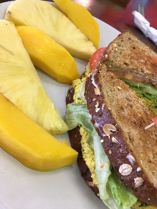 Better Than Egg Salad sandwich on toast (Killer Dave's bread) and added lettuce and tomato with side of fruit (mango and pineapple) at Pure Natural Market in Hilton Head Island