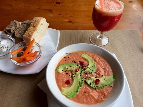 Bread and garlic spread, crudités, Salmorejo (chilled garlic and tomato soup), and fresh juice at Hicuri in Granada