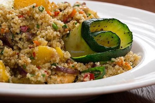 Couscous with almonds, peaches, grilled zucchini and sunflower sprouts at Pod Papugami in Wroclaw