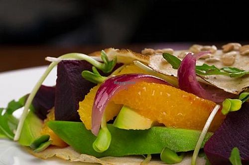 Buckwheat Pancakes with beetroot, orange, avocado, pickled red onion, sunflower seeds, pumpkin seeds and rucola at Pod Papugami in Wroclaw