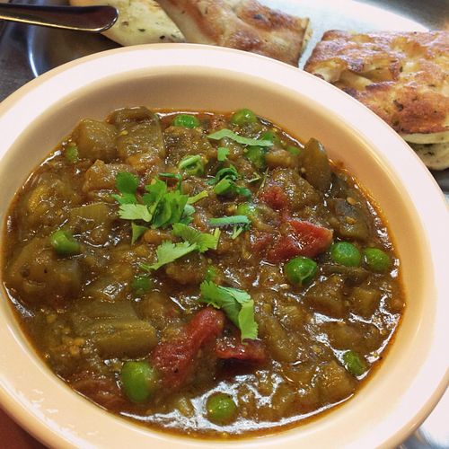 Baingan Bharta (spiced egglplant) with garlic naan. at Swad Vegetarian Indian in Greenville