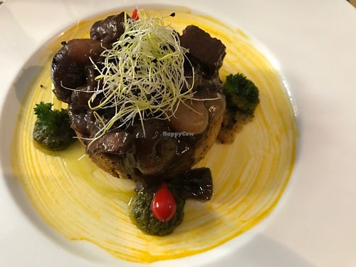 Seitan in wine sauce served with a potato patty at L'Orto Gia Salsamentario in Turin