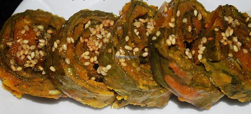 Alu Wadi - Taro leave interleaved with chick pea flour, tarmarind and tempered with linseed. Great VEGAN item with a tangy taste! at Saattveek in Auckland