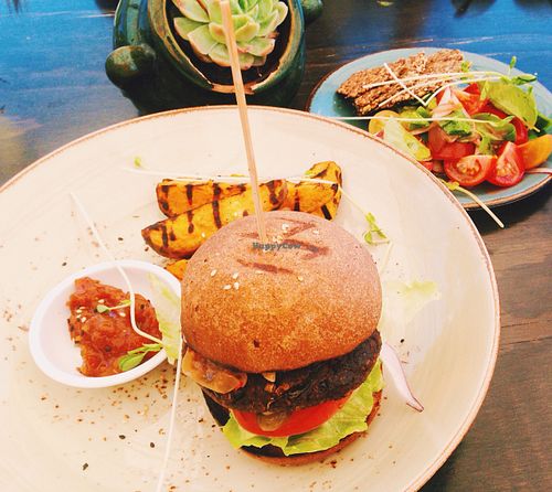 Vegan burger with sweet potato wedges and five seed crackers with avocado  at Thomas's Bach in Waiheke Island