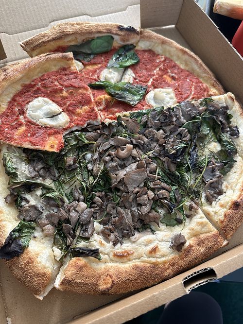 Margarita pizza (top) and truffle cream pizza (below)  at Double Zero in New York City