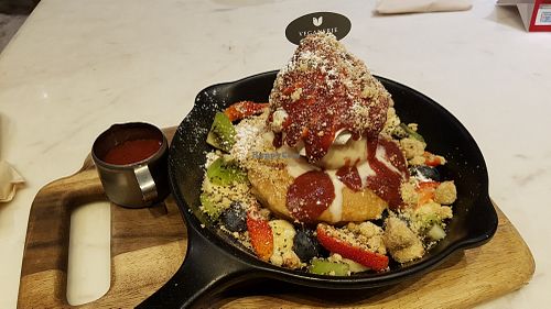 Pancakes, fruits and vanilla ice cream at Veganerie Concept - Benjasiri Park in Bangkok