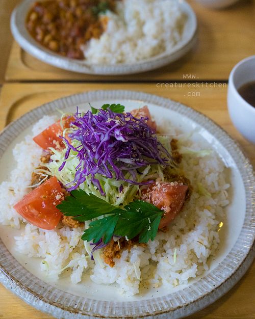Vegan taco rice (front) and curry rice (behind) with side soups. at Musubi Cafe in Kyoto