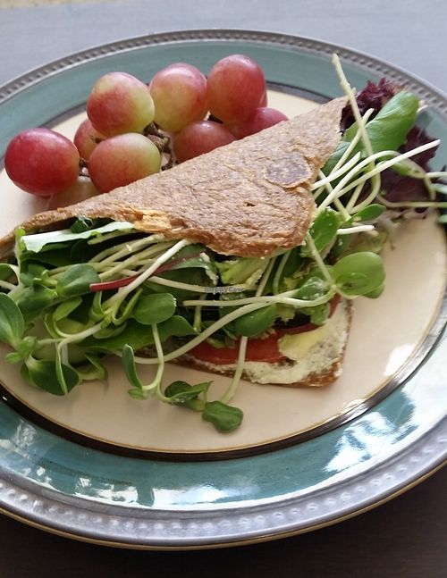 Mouth watering raw vegan organic veggie wrap. Everything made in house! Cashew zucchini hummus, guacamole, tomato, micro greens, cucumber and field greens! at Old Earth Pure Organic Food in St Petersburg