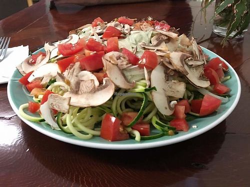 Zughetti Alfredo. Spiralized zucchini noodles with our house made cashew based Alfredo sauce topped with fresh tomato, thinly sliced onion and crimini mushrooms. at Old Earth Pure Organic Food in St Petersburg