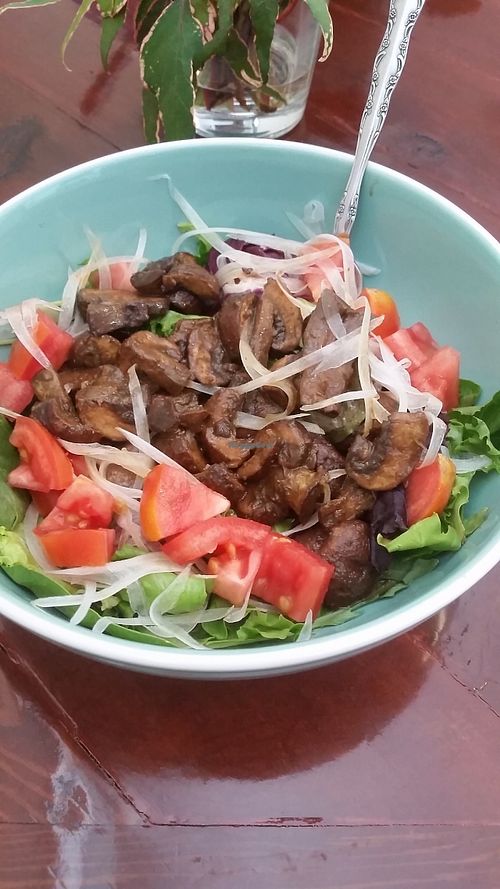 'Shroom salad. Mixed greens, thinly sliced onion, tomato with crimini mushrooms coated in our herbed balsamic vinaigrette.  at Old Earth Pure Organic Food in St Petersburg