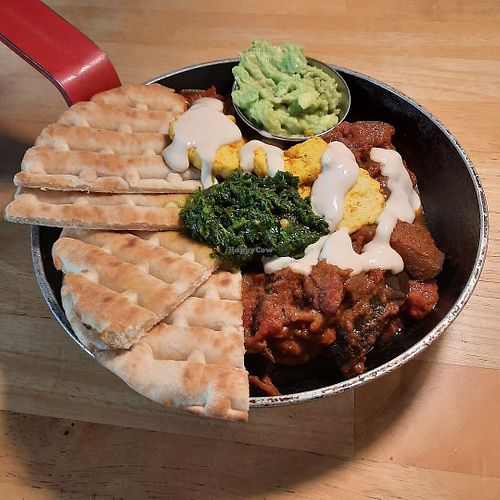 Aubergine and red pepper shakshuka with added avocado at Cafe Van Gogh in South West London
