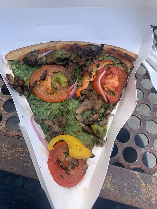 Vegan veggie pizza with cornmeal crust.  at Good Earth Natural Foods in Mill Valley