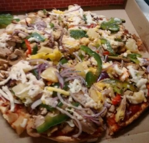 a supreme pizza at Feed The Earthlings in Burleigh Waters
