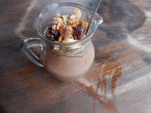 Amazing vegan chocolate mousse in a mug with cashew granola and coconut milk. To die for! at Plernpai Vegetarian Cafe in Mae Hong Son
