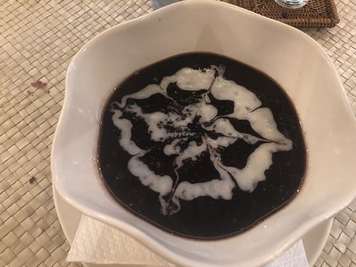 Black Rice Pudding Dessert with coconut cream topping at Gopal's Cafe in Sanur