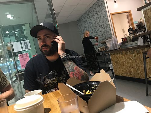 Cool cats eating and rocking their phones at Rabbits Cafe in Portland