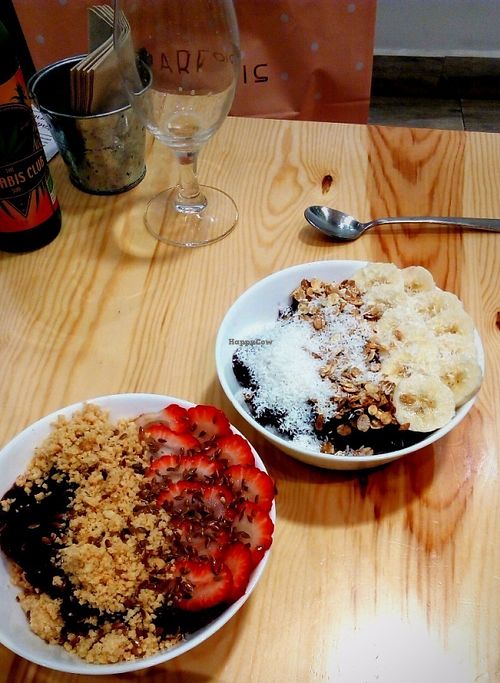 Açai bowls with strawberries, flax seeds and peanut crumble & with bananas, coconut and granola at Almalibre Acai Bar in Valencia