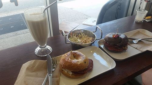 Vegan pizza bagels, house slaw with incredible tahini dressing, peanut butter mylkshake and coffee! Amazing! at Flux Valley in Fortitude Valley