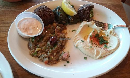 veggie combo plate: hummus, eggplant salad, dolma (rice wraps), falafel, and non vegan sauce (has milk) at Hummus Mediterranean Cuisine in San Mateo
