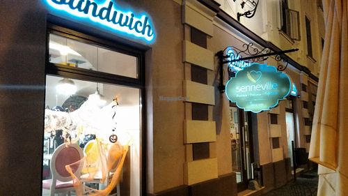 Senneville storefront by night at Seneville Cafe in Timisoara