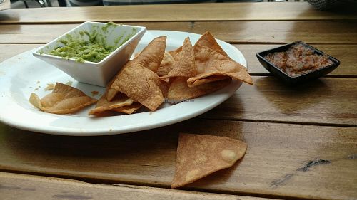 Half eaten chips, guac, salsa at No Bones Beach Club in Seattle