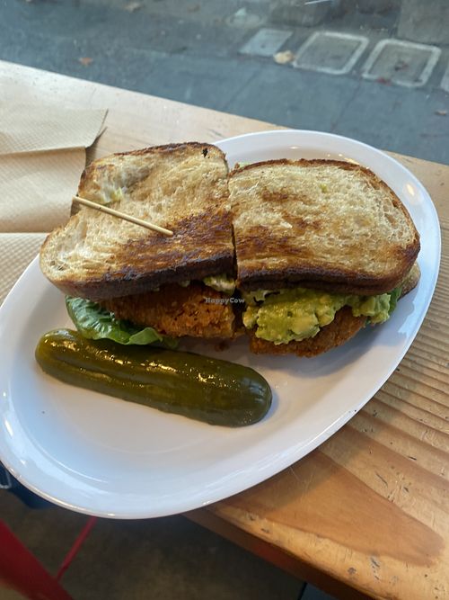 Killer BLAT: sourdough w/ fried chicken, mayo, lettuce, tomato, bacon, jalapeños (removed) & smashed avocado 😋 Would totally order again, minus I don’t do spicyy  at The Butcher's Son in Berkeley